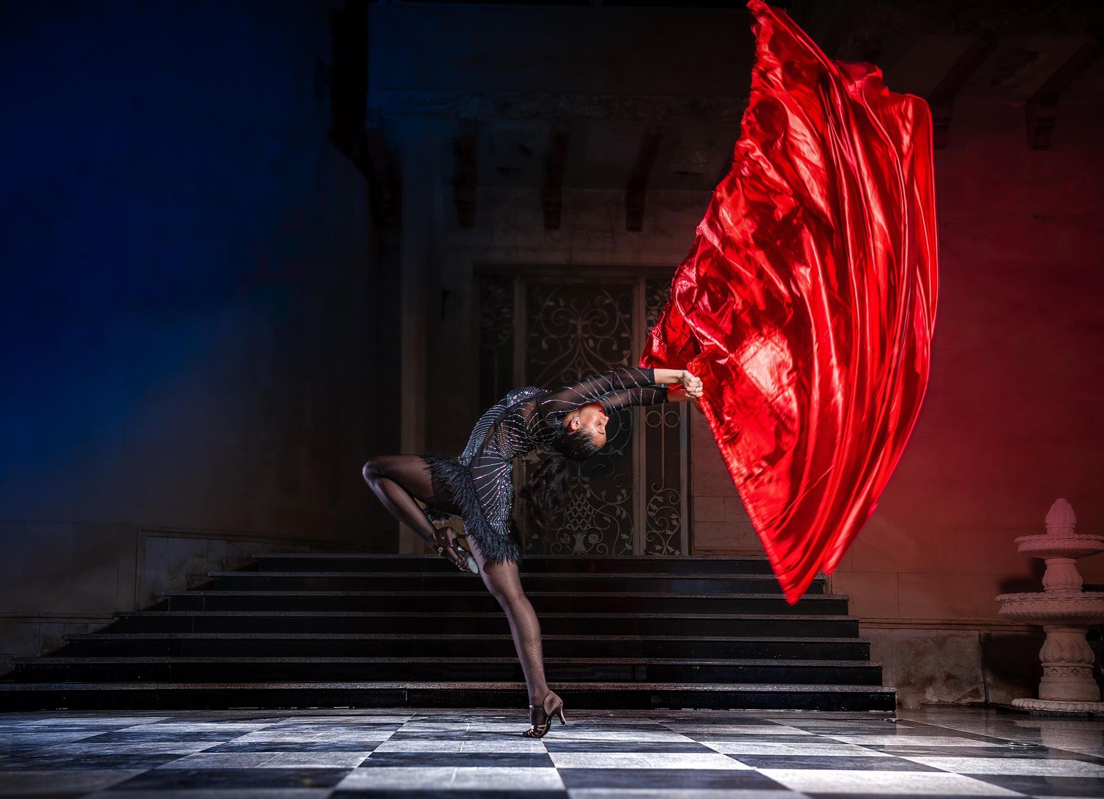 Jood Alamoudi dancing with flowing red silk